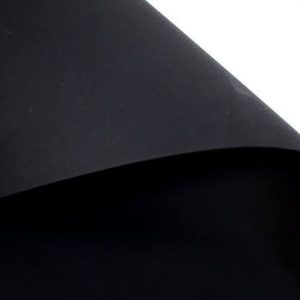 Curious Matter Black Truffle specialty paper showing an intense, ultra-matte charcoal black shade with a unique tactile sand-like texture.